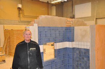 12-tal til den første kvindelige flisemurer